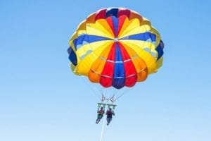 Two people parasailing.