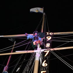 Pirate on top of ship mast.