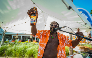 Photo of a Man Holding a Beer at the Key West Brewfest.