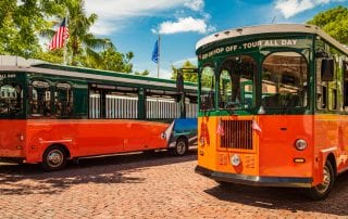 Photo of Two Tour Buses. Click Here for More Information about Visiting Key West in January.