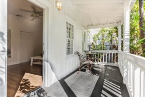 Relax on a the porch of your Key West cottage before going to brunch.