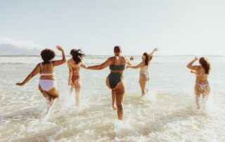 A group of women on the beach during a Key West bachelorette party.
